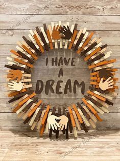 i have a dream wreath made out of wooden sticks and handprints on it