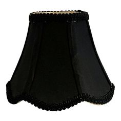 a black lamp shade with scalloped edges