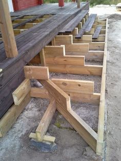 the wooden steps are ready to be built into the house's roof structure,