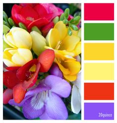 a bouquet of colorful flowers sitting on top of a green table next to a pantone board