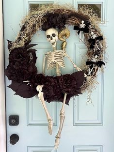 a skeleton wreath is hanging on the front door