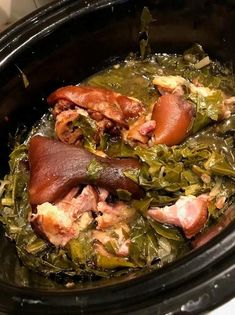 cooked meat and greens in a slow cooker