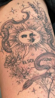 the sun and moon tattoo on someone's thigh