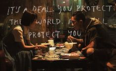 a man and woman sitting at a table with coffee cups in front of them that say, it's not ideal you protect the world as evil protect you