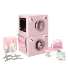 a play kitchen set with pink appliances and accessories