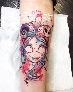 a woman's leg with a tattoo on it that has an image of a cat