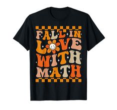 a black t - shirt that says fall in love with math