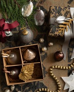 an assortment of christmas ornaments and decorations on a table