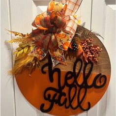 a door hanger with the word hello fall on it