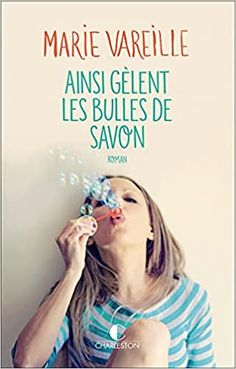 a woman blowing bubbles in front of her face with the caption's name above her head