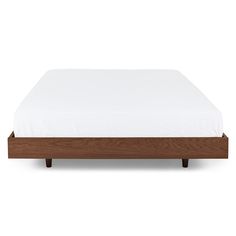 an image of a bed with white sheets and wooden headboard on the bottom side