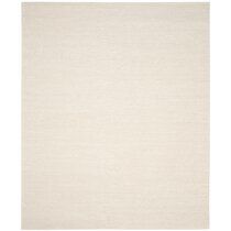 a beige rug on a white background with no one in the room to see it