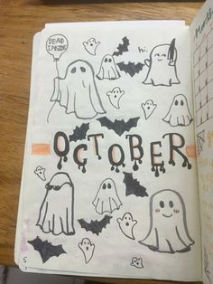 an open notebook with halloween drawings on it