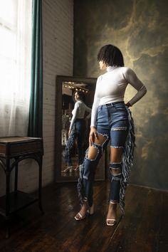 Fringe is in! A lil thigh never hurt nobody either. These distressed ripped jeans are a statement piece you will happy to add to your Jean selection, The looks you can create with these jeans are endless. great stretch model 5’7 wearing a size small fringe down sides tapered leg size small 1-4 medium 5-8 large 9-12 Fringe Cutoff Denim Jeans, Medium Wash Fringe Jeans, Medium Wash High Rise Fringe Jeans, Mid-rise Denim Jeans With Fringe, Small Fringe, Non-stretch Distressed Denim Pants, The Vibe, Black Media, Ripped Jean