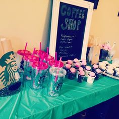 a table topped with cupcakes and drinks