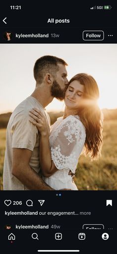 a man and woman are kissing in the field