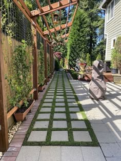 an outdoor walkway with artificial grass in the middle