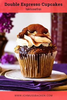 a close up of a cupcake on a plate with the words double espresso cupcakes above it