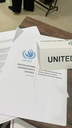 several papers are stacked on top of each other with the united nations logo on them