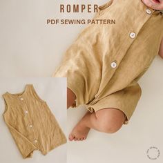 a baby laying on the ground wearing a romper