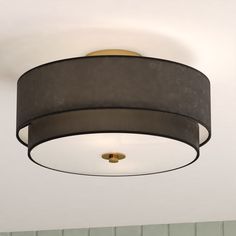 a round light fixture hanging from the ceiling