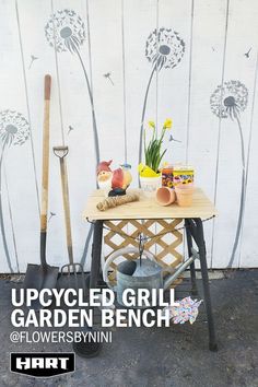 a table with gardening tools and flowers on it