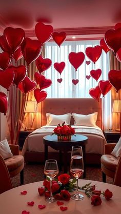 a room decorated for valentine's day with heart balloons