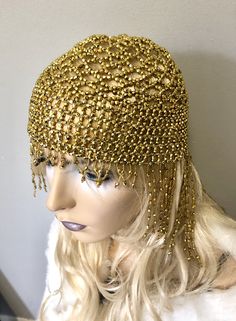 "Sassy headdress hat with all over shiny beads and fringe in front and back. Beads hang 4\"-6\" in the back and 1\" front with Stretch to fit around entire head. Color: Gold" Adjustable Rhinestone Headpiece For Festival, Adjustable Rhinestone Festival Headpiece, Adjustable Festival Headpiece With Rhinestones, Bohemian Headpiece For Mardi Gras Party, Bohemian Headband Costume Hats And Headpieces For Party, Bohemian Headpiece For Carnival Party, Adjustable Silver Costume Hats And Headpieces For Festival, Flapper Hat Headpiece For Party, Flapper Party Hat Headpiece