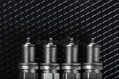 four metal nuts are lined up in a row on a black background royalty images and stock photos