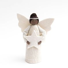 an angel figurine holding a star