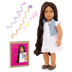 a doll with long hair next to a photo frame