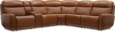 a brown leather couch with three reclinings on the back and one arm extended