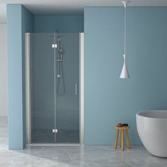 a bathroom with blue walls and a white bathtub next to a stand up shower