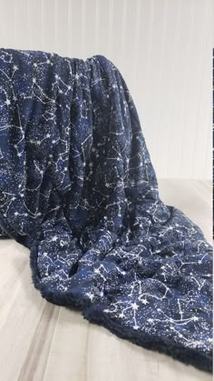 a blue blanket with white stars on it