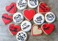 decorated cookies are arranged in the shape of hearts