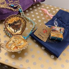 there are many items on the table to be seen in this photo, such as brooches and necklaces