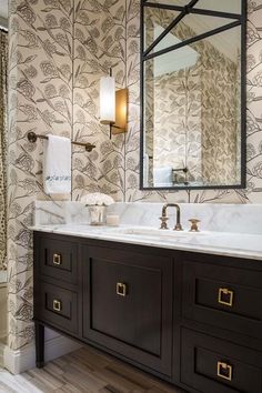 a bathroom with a large mirror above the sink