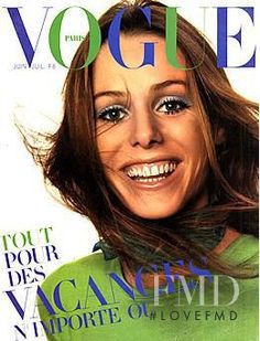 a magazine cover with a woman smiling for the camera