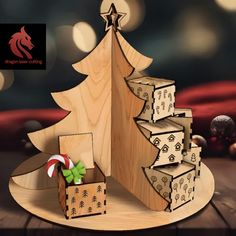 a wooden christmas tree with presents under it