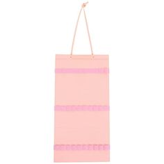 a pink shopping bag hanging from a string