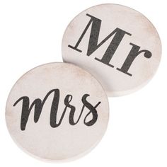 two coasters with the word mr and mrs printed on them, both in black ink