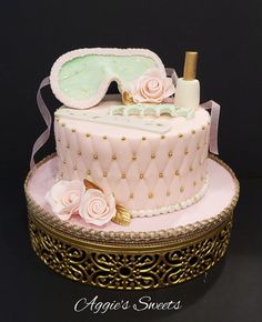 there is a cake that has been decorated in pink and gold