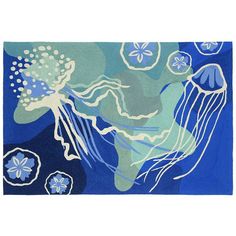 a blue and green rug with jellyfish on it