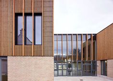 two brick buildings with glass doors on each side