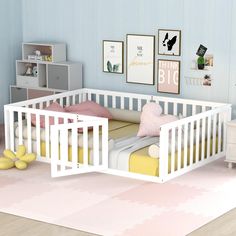 a baby's room with a white crib and pink rug on the floor