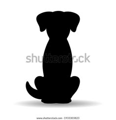 a black silhouette of a dog sitting on the ground with its head turned to the side