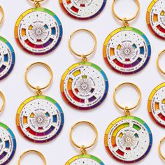 many different colored key chains are arranged in the shape of an open wheel with wheels on each side