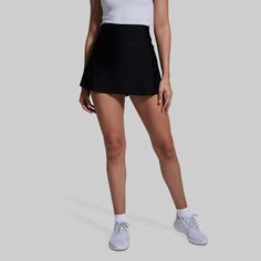 Ladies Tennis Golf Skirt | Born Primitive | Skirt with Built-In-Shorts Sporty Black Tennis Skirt With 4-way Stretch, Black Sporty Tennis Skirt With 4-way Stretch, Functional Black Tennis Skirt With Built-in Shorts, Tennis Bottoms With Built-in Shorts And 4-way Stretch, Black Athleisure Tennis Skirt With Go-dry, Black 4-way Stretch Skort For Sports, Black Sporty Skort For Sports, Black Stretchy Functional Tennis Skirt, Sporty Black Skort For Sports