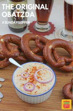 the original obatzda is served in a bowl with onion rings