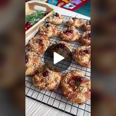 the video shows how to make cranberry danish pastries on a wire rack